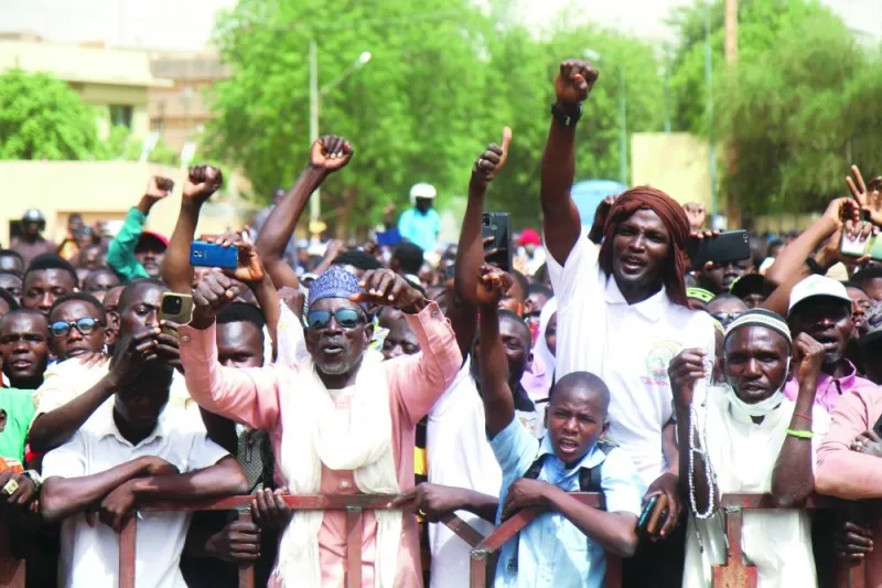 Nigeriens gather in a street to protest against the US military presence, in Niamey, Niger, yesterday.