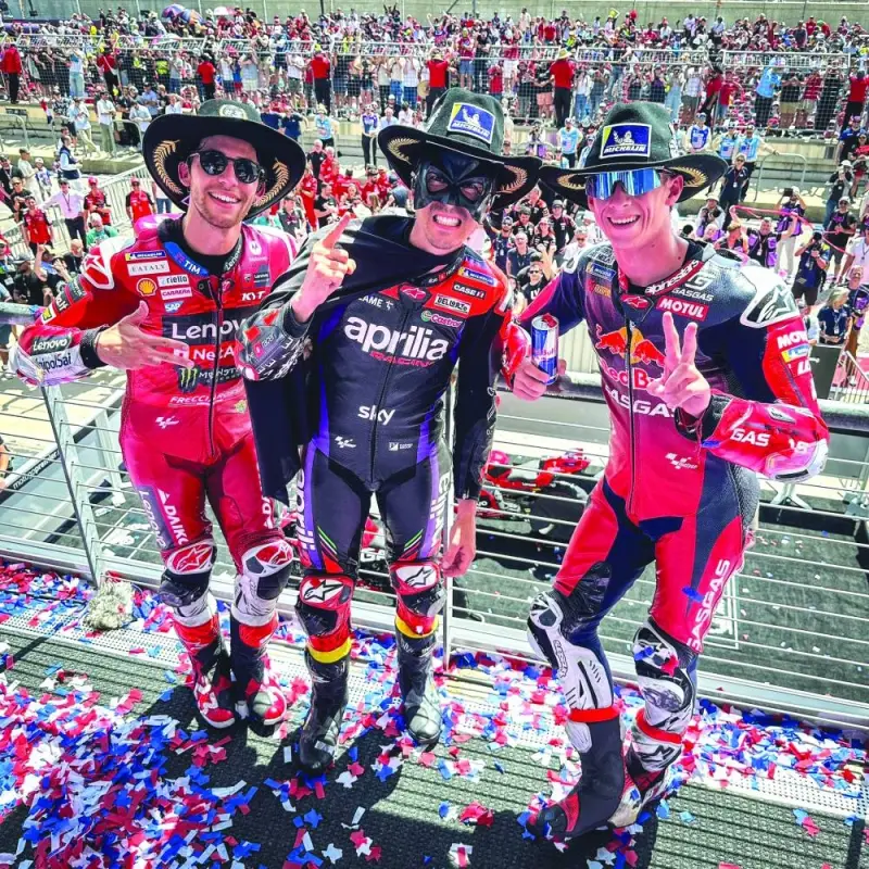 Maverick Vinales (centre) celebrates with second placed Pedro Acosta (right) and third placed Enea Bastianini after winning the Grand Prix of the Americas MotoGP in Texas yesterday. (MotoGP)