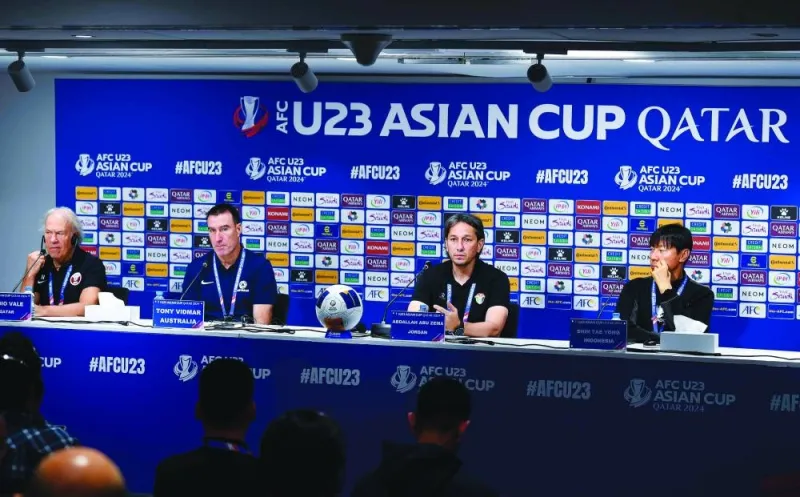From left: U-23 coaches – Ilidio Vale of Qatar, Tony Vidmar of Australia, Abdallah Abu Zema of Jordan and Shin Tae-yong of Indonesia – attend a press conference in Doha yesterday.