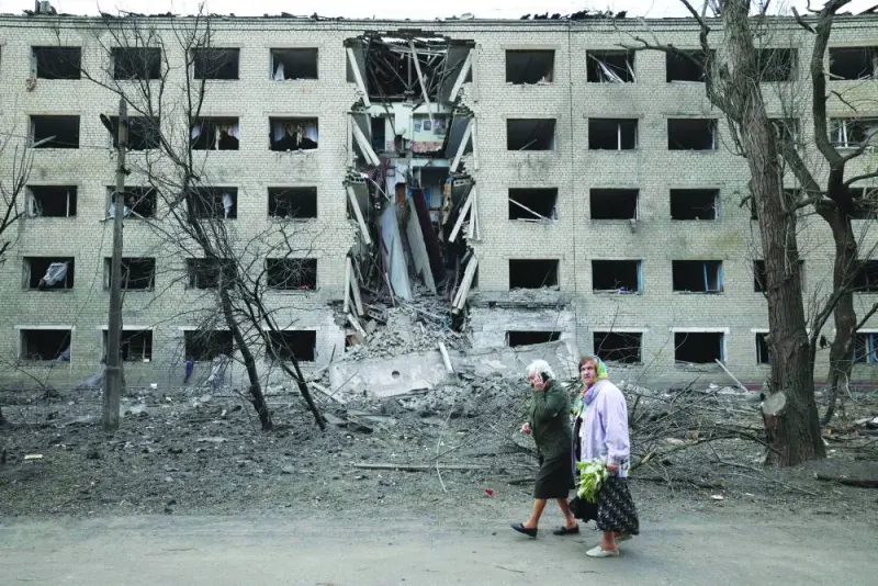 
Elderly women walk past a hostel destroyed during a missile attack in the town of Selydove, in Ukraine’s Donetsk region. 