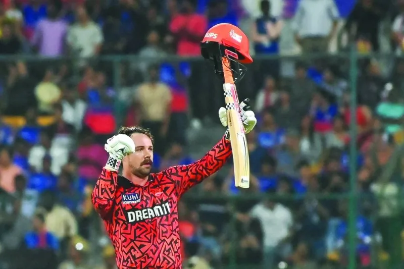 Sunrisers Hyderabad’s Travis Head celebrates after scoring a century during the IPL match against Royal Challengers Bengaluru in Bengaluru on Monday. (AFP)