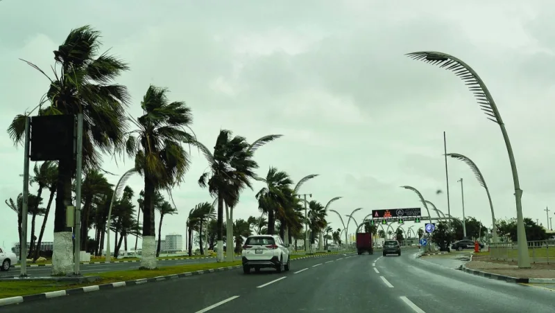 The ornamental palms on Doha Corniche sway in strong winds Tuesday. PICTURE: Shaji Kayamkulam