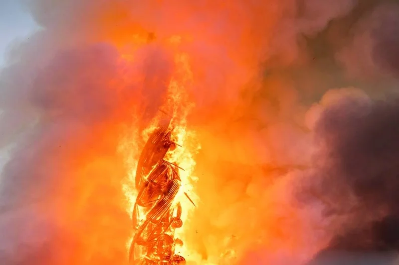 Flames rise from the Dragon Spire of the Stock Exchange in Copenhagen.
