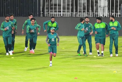 
Pakistan’s captain Babar Azam (centre) warms up along with teammates during a practice session in Rawalpindi yesterday. Babar makes his return as Pakistan captain in a five-match Twenty20 series starting tomorrow against an understrength New Zealand with the World Cup weeks away. (AFP) 
