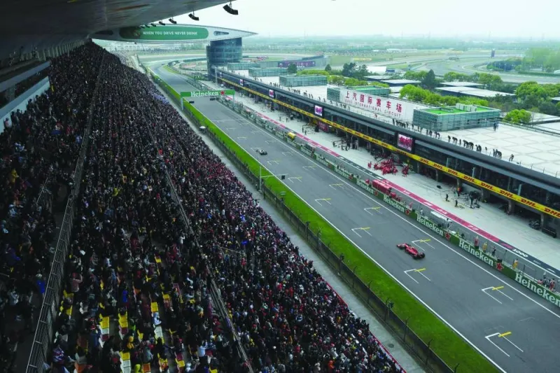 
This general view shows spectators watching the Formula One Chinese Grand Prix in Shanghai on April 14, 2019. Two years ago the Shanghai International Circuit hosted a Covid hospital, but this weekend it will stage Formula One once more as the sport returns to China for the first time since the pandemic. (AFP) 