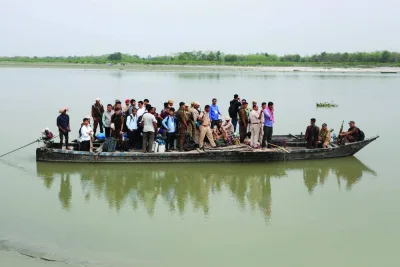 
Polling and police officers travel in a boat with election materials to reach a remote polling station ahead of the first phase of India’s general election in the Majuli district, in the northeastern state of Assam, India, yesterday. 