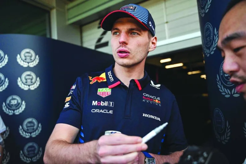 Red Bull Racing&#039;s Dutch driver Max Verstappen signs an autograph at the Shanghai International circuit ahead of the Formula One Chinese Grand Prix in Shanghai on Thursday. (AFP)