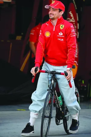 Ferrari’s Monegasque driver Charles Leclerc rides his bike at the Shanghai International circuit on Thursday, ahead of the Formula One Chinese Grand Prix in Shanghai. (AFP)