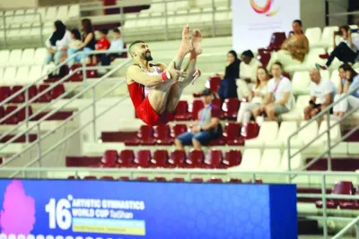 
A gymnast performs during the vault qualification. 