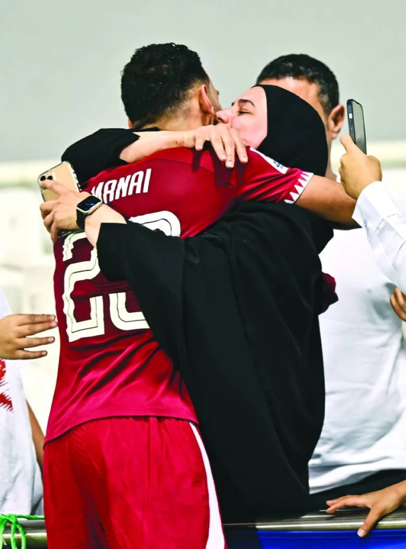 Qatar’s Mohamed al-Mannai celebrates with his family member after scoring a dramatic winner against Jordan in the AFC U-23 Asian Cup at the Jassim Bin Hamad Stadium on Thursday. PICTURES: Noushad Thekkayil