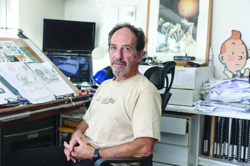 South African cartoonist Jonathan Shapiro, known as Zapiro, poses for a photo in his studio in Cape Town.