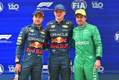 Red Bull Racing’s Mexican driver Sergio Perez, Red Bull Racing’s Dutch driver Max Verstappen (centre) and Aston Martin’s Spanish driver Fernando Alonso (right) pose after the qualifying session for the Formula One Chinese Grand Prix at the Shanghai International Circuit in Shanghai on Saturday. (AFP)