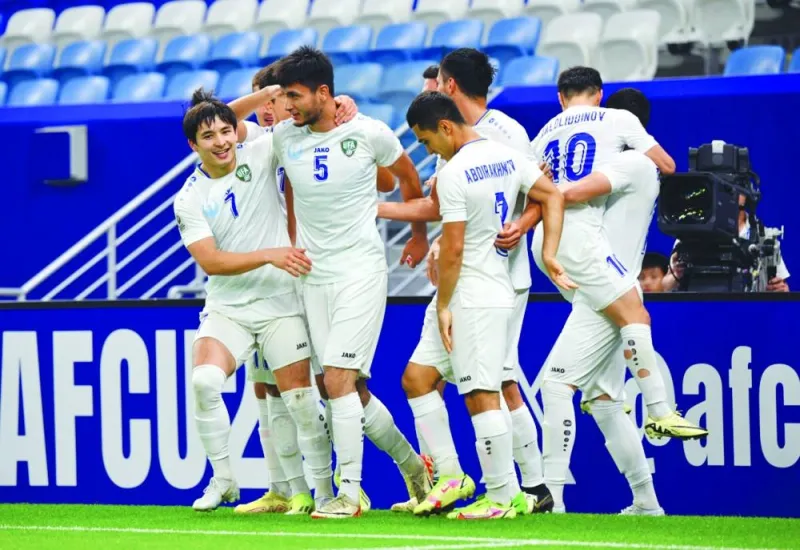 Uzbekistan players celebrate after their win over Kuwait in the AFC U-23 Asian Cup on Saturday.