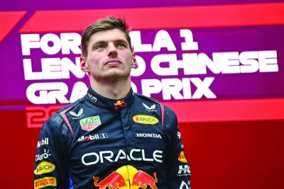 Red Bull Racing's Dutch driver Max Verstappen stands on the podium after winning the Formula One Chinese Grand Prix at the Shanghai International Circuit in Shanghai on April 21, 2024. (Photo by PEDRO PARDO / AFP)