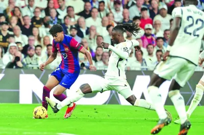 
Barcelona’s Lamine Yamal (left) is tackled by Real Madrid’s Eduardo Camavinga during the La Liga match at the Santiago Bernabeu stadium in Madrid on Sunday. (AFP) 
