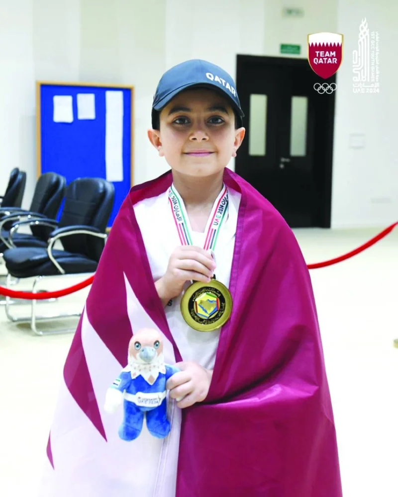 
Qatar’s Khaled al-Jamaat poses with the gold medal. 