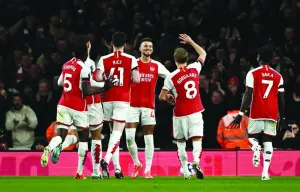 
Arsenal’s Ben White (third right) celebrates with teammates after scoring against Chelsea during the Premier League match. (Reuters) 
