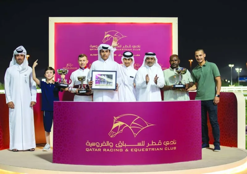 The connections of Local Law celebrate after the Saif Rashid Saif al-Khayarin-owned six-year-old horse won the Al Jumayliyah Cup at the QREC’s al Rayyan racecourse on Wednesday. PICTURES: Juhaim