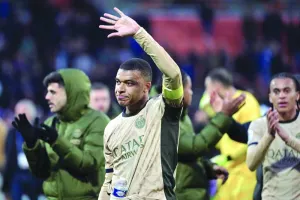 PSG forward Kylian Mbappe waves to the crowd at the end of the Ligue 1 match against Lorient in Lorient on Wednesday. (AFP)