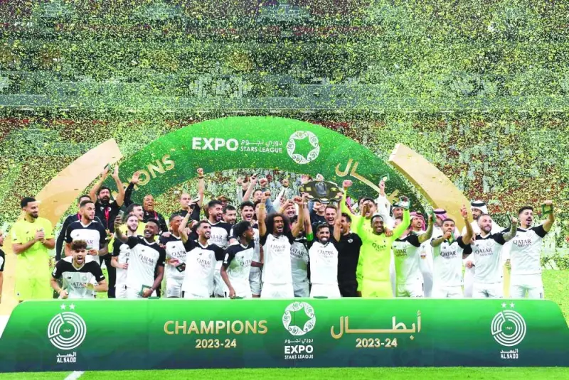 Al Sadd players celebrate with the winner’s Shield after clinching the Expo Stars League title at the Al Bayt Stadium in Al Khor on Wednesday.