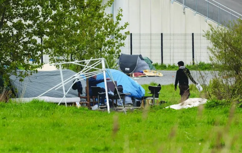 
Migrants wander around a makeshift camp near Calais, France. (AFP) 