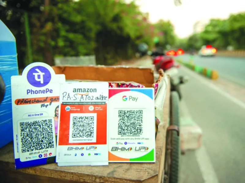 Signs of QR code based mobile-payment of different companies display at a stall in India.  (AFP)