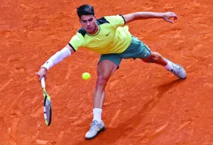 Spain’s Carlos Alcaraz returns the ball to Russia’s Alexander Shevchenko during the 2024 Madrid Open match on Friday. (AFP)