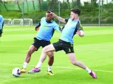 Arsenal’s Jurrien Timber (left) and Declan Rice at a training session on Friday.