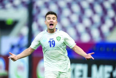 Uzbekistan’s Khusain Norchaev celebrates after scoring against Saudi Arabia in the quarter-finals of the AFC U-23 Asian Cup at the Khalifa International Stadium on Friday.