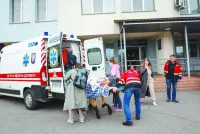 A child is evacuated from a hospital in Kyiv after local authorities declared that there was possible danger of a Russian military strike.