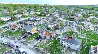 A drone view shows emergency personnel working at the site of damaged buildings in the aftermath of a tornado in Omaha, Nebraska, in this still image obtained from social media.