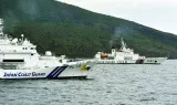 
A China Coast Guard vessel sails near a Japan Coast Guard vessel in Motobu off Uotsuri Island, one of a group of disputed islands called Senkaku Islands in Japan, also known in China as Diaoyu Islands, in the East China Sea. 
