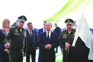 
Russian Deputy Defence Minister Timur Ivanov gives explanations to President Vladimir Putin, Defence Minister Sergei Shoigu and Patriarch Kirill, head of the Russian Orthodox Church, who inspect a model of the Main Cathedral of the Russian Armed Forces in the course of its construction near Moscow on September 19, 2018. (Reuters) 
