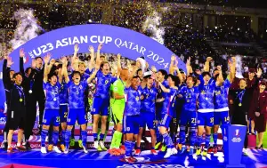 Japan players celebrate with the trophy after winning the AFC U-23 Asian Cup at the Jassim Bin Hamad Stadium in Doha on Friday. PICTURES: Noushad Thekkayil