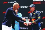 Sprint winner Max Verstappen of Red Bull receives the award from football legend Zinedine Zidane after winning the Miami Grand Prix sprint race on Saturday. (AFP)
