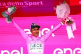 Team Ineos’ Jhonatan Narvaez of Ecuador celebrates on the podium in overall leader’s pink jersey after winning the stage 1 of the Giro d’Italia, the 140km race between Venaria Reale and Turin, on Saturday. (AFP)