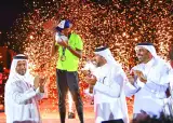 Qatar’s Mutaz Essa Barshim celebrates with the trophy after winning the ‘What Gravity Challenge’ at the Katara Amphitheatre on Thursday. Dr Thani bin Abdulrahman al-Kuwari, Second Vice-President of Qatar Olympic Committee and Mohamed Issa al-Fadala, Qatar Athletics Federation President, are also seen in the picture.