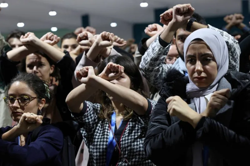 Activists hold a silent protest against the draft agreement, during the COP29 United Nations Climate Change Conference, in Baku, Azerbaijan on Friday. REUTERS Activists hold a silent protest against the draft agreement, during the COP29 United Nations Climate Change Conference, in Baku, Azerbaijan on Friday. REUTERS