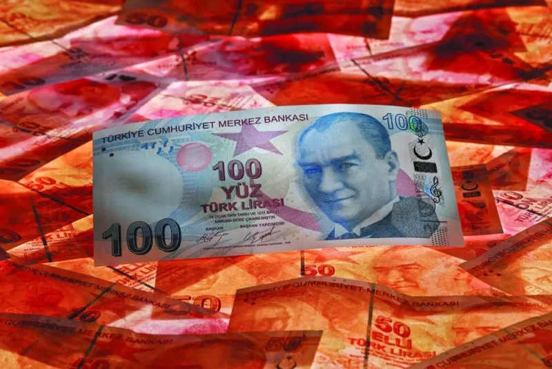 A 100 Turkish lira banknote is seen on top of 50 lira banknotes in this picture illustration in Istanbul. Turkiye’s new requirement for money-market funds to allocate at least 10% of their portfolios to government bonds is set to channel billions of liras into Treasury debt, driving up demand for the short end of the yield curve. A 100 Turkish lira banknote is seen on top of 50 lira banknotes in this picture illustration in Istanbul. Turkiye’s new requirement for money-market funds to allocate at least 10% of their portfolios to government bonds is set to channel billions of liras into Treasury debt, driving up demand for the short end of the yield curve.