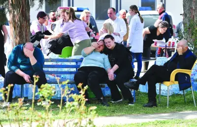 DISTRAUGHT: Relatives of the victims of an overnight fire in a crowded nightclub in North Macedonia wait for news of their loved ones at the Kocani General Hospital in Kocani yesterday. (AFP) DISTRAUGHT: Relatives of the victims of an overnight fire in a crowded nightclub in North Macedonia wait for news of their loved ones at the Kocani General Hospital in Kocani yesterday. (AFP)