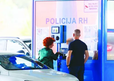 A woman undergoes registration under the Entry/Exit System, at the Bajakovo border crossing in Croatia, Sunday. A woman undergoes registration under the Entry/Exit System, at the Bajakovo border crossing in Croatia, Sunday.