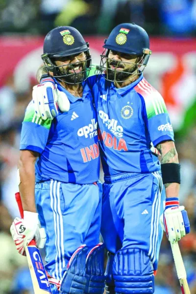 India’s Rohit Sharma (left) celebrates with his teammate Virat Kohli after scoring a century during the third ODI against Australia at the Sydney Cricket Ground in Sydney Saturday. AFP India’s Rohit Sharma (left) celebrates with his teammate Virat Kohli after scoring a century during the third ODI against Australia at the Sydney Cricket Ground in Sydney Saturday. AFP