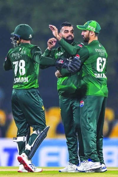 Pakistan's Shadab Khan (centre) celebrates with team-mates after taking the wicket of Sri Lanka's Dhananjaya de Silva during the first Twenty20 match at the Rangiri Dambulla International Stadium in Dambulla Wednesday. (AFP) Pakistan's Shadab Khan (centre) celebrates with team-mates after taking the wicket of Sri Lanka's Dhananjaya de Silva during the first Twenty20 match at the Rangiri Dambulla International Stadium in Dambulla Wednesday. (AFP)