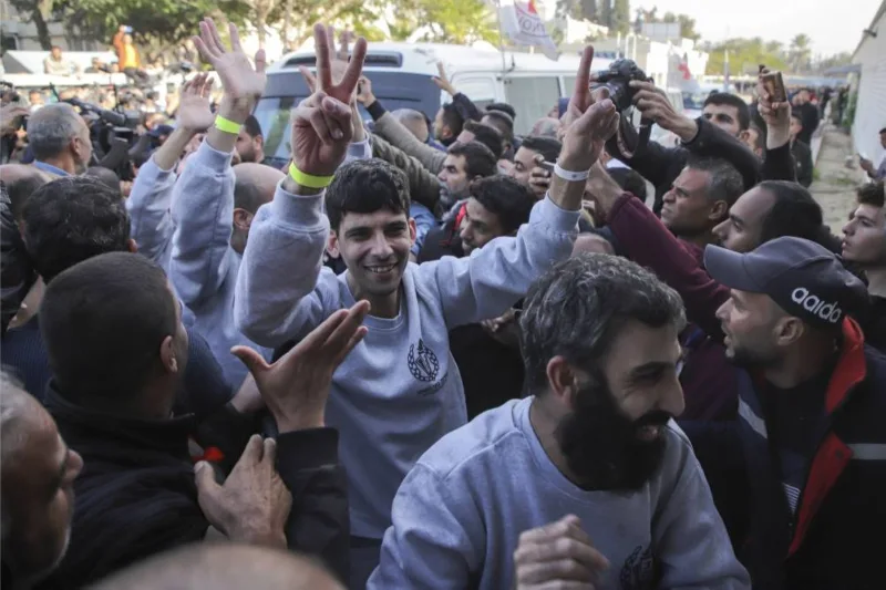 Crowds cheer, families hug as Palestinian prisoners released 5 Crowds cheer, families hug as Palestinian prisoners released