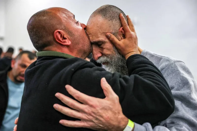 Crowds cheer, families hug as Palestinian prisoners released 2 Crowds cheer, families hug as Palestinian prisoners released