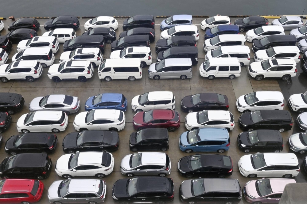 Used cars to be shipped to Russia are parked at a port in the city of Toyama last August.