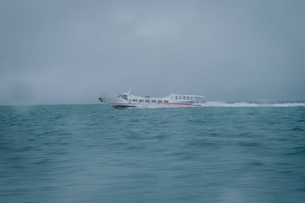 A local ferry skims the surface of the water on its journey between Okinawa's southernmost islands. 
