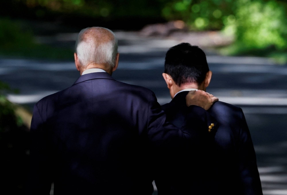 U.S. President Joe Biden and Prime Minister Fumio Kishida depart following a joint news conference during a trilateral summit at Camp David, Maryland, on Friday.