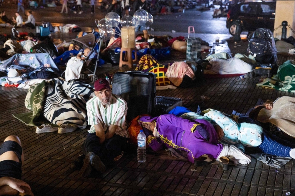 Residents take shelter outside at a square following a powerful earthquake in Marrakesh, Morocco, on Saturday.