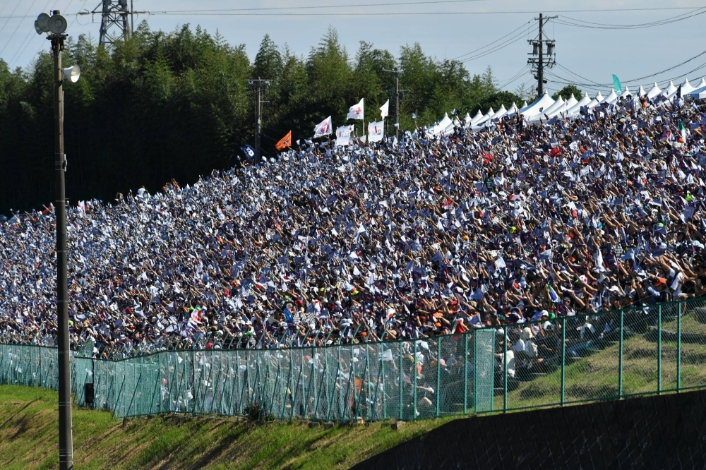 Fans at Turn 2 await the start of the Japanese Grand Prix.
